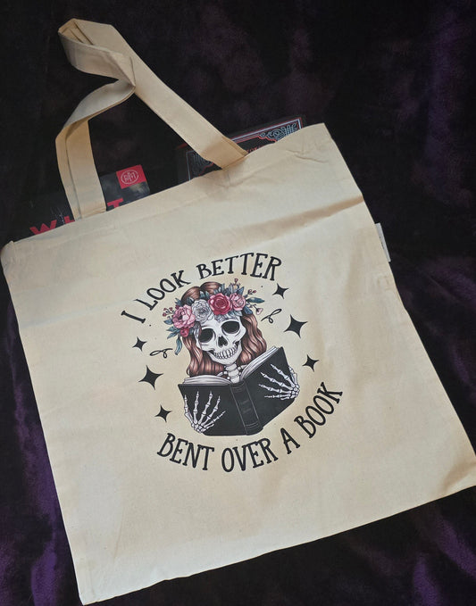 Bent Over a Book Canvas Tote Bag